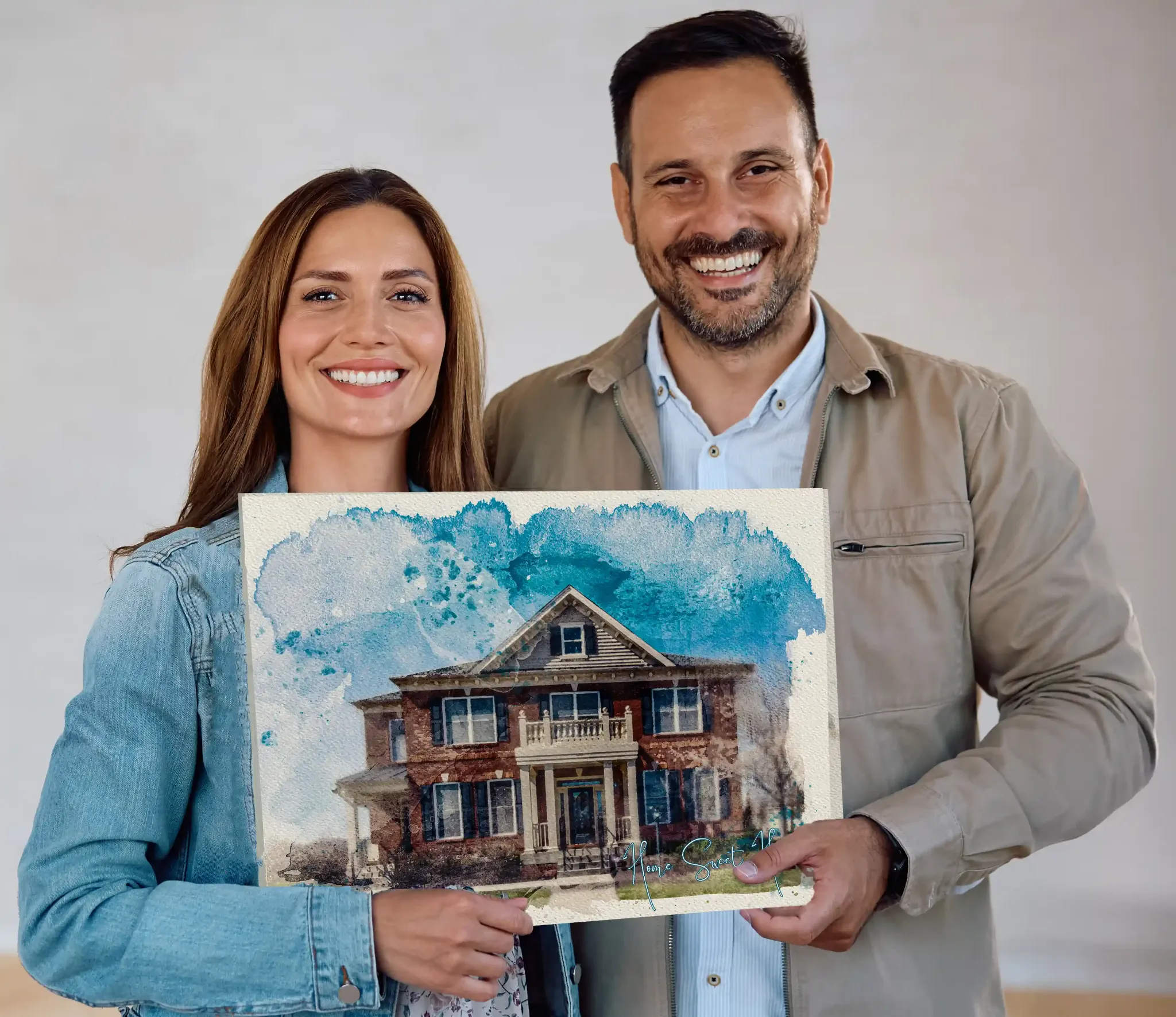 Happy couple holding house portrait